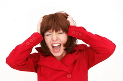 Woman tearing her hair out because of the noise.